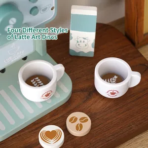 Wooden coffee maker play set for kids featuring mint green machine and cups