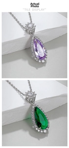 Macro shot of pear-cut purple and green zircon pendants with luxury pavé diamond details