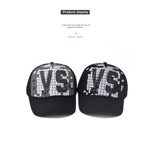 Detail of two baseball caps featuring 3D VS puzzle print and classic curved brims