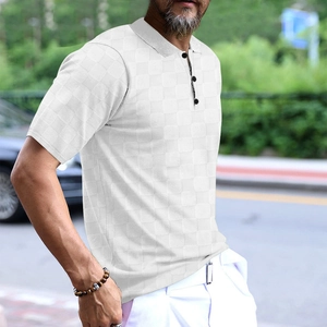 Close-up of white waffle texture fabric on men's short sleeve polo shirt with dark buttons