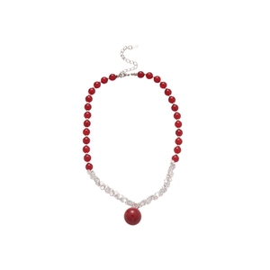 Red beaded necklace with large round pendant and silver lobster clasp on white background