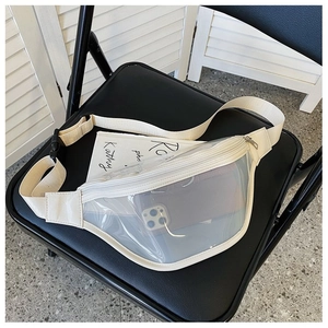 Clear PVC fanny pack showing storage capacity for smartphones on a black chair