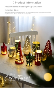 Close-up of glass Christmas candle holder with reindeer and forest patterns with warm LED light