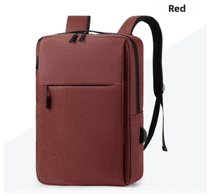Detail view of red laptop backpack featuring built-in USB charging port and zipper pocket