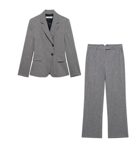 Flat lay of gray women's professional suit with two-button blazer and wide-leg pants