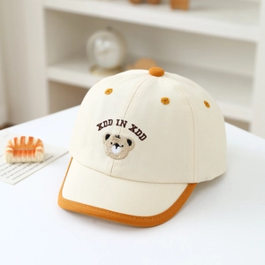 Close-up of the cute bear embroidery and precise stitching on the cotton baseball cap