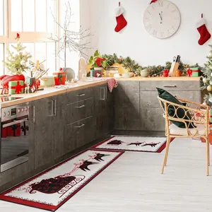 Detail of Christmas kitchen mat set with Santa reindeer design in a cozy kitchen setup