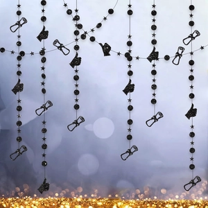 Detail of black glitter graduation party banners with scroll and star patterns