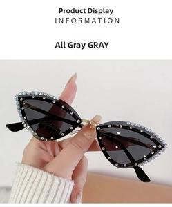 Close-up of cat-eye sunglasses featuring colorful rhinestones on a gray frame