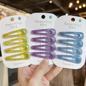 Three sets of glitter teardrop hair clips for girls in yellow, purple, and blue colors