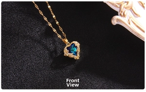 Front view of angel wing heart necklace with a deep blue crystal and golden chain