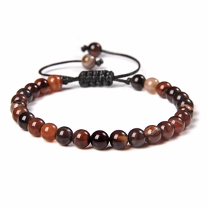 Macro shot of 6mm natural stone beads with adjustable handmade braided black cord