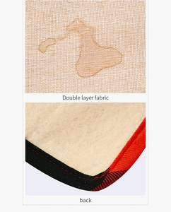 Detail of waterproof linen table runner with red plaid edge and soft velvet back