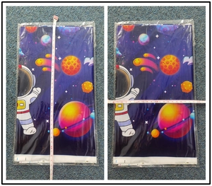 Space astronaut party tablecloth shown with measuring tape for size 35x20cm