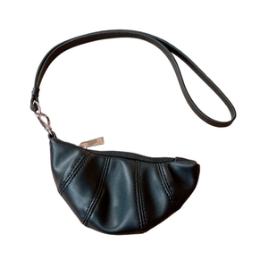 Minimalist black faux leather croissant necklace bag with detailed segmented stitching