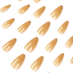 French nude almond press-on nails with luxury gold glitter gradient tips in a full set