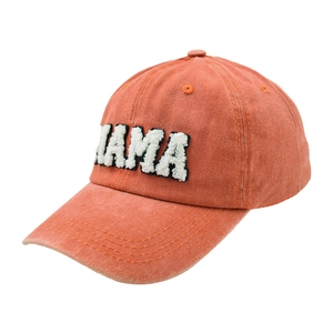 Detail of vintage washed cotton baseball cap with orange MAMA letter embroidery
