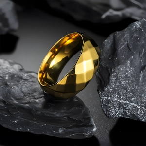Polished gold 8mm faceted geometric ring for men displayed on a natural rock background