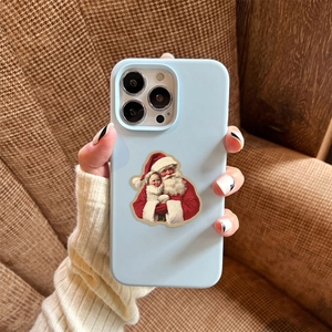 Detail of light blue silicone phone case with vintage Santa Claus illustration