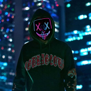 Macro view of LED mask with blue and pink glowing neon wires and cross eye detail