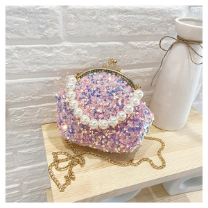 Pink sequin shell bag with elegant pearl handle and vintage metal clasp closure