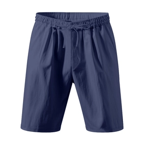 Detailed view of navy blue linen shorts with drawstring waist and deep side pockets