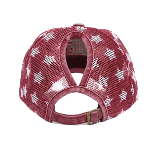 Detail of burgundy ponytail baseball cap with white stars and breathable mesh back