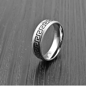 8mm silver stainless steel men's ring with Greek key pattern on dark wood background