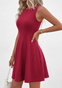Detail view of wine red sleeveless dress with round neck and flattering slim fit waist