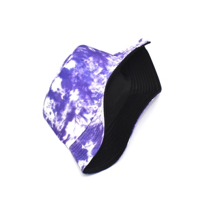 Detail of purple tie-dye bucket hat showing cotton texture and black inner lining