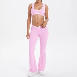 Detail of pink yoga set with cross waist leggings and contrast piping sportswear