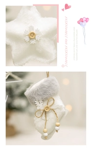 Close-up of white plush Christmas ornaments with star, sock, and wooden buttons