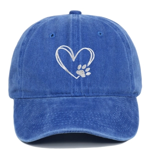 Detailed embroidery of heart and dog paw prints on navy washed cotton baseball cap