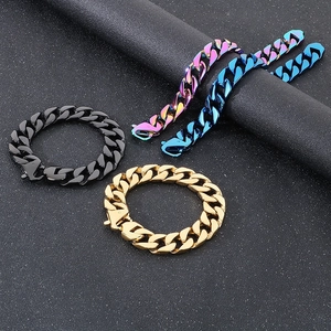 Close-up of four Cuban chain bracelets in black, gold, blue, and rainbow finishes on black