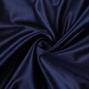 Close-up of deep blue satin fabric showing smooth silky texture and elegant glossy finish