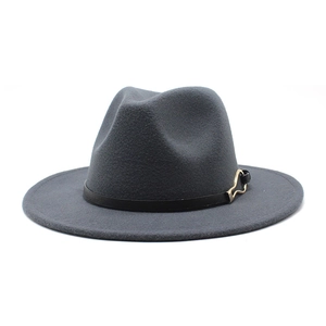 Detailed macro view of dark grey fedora hat featuring a thin black belt and gold buckle
