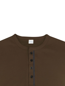 Close-up of the collar and four black buttons on a brown textured men's polo shirt