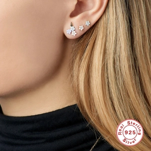 Delicate 925 sterling silver flower stud earrings in light blue and cream enamel
