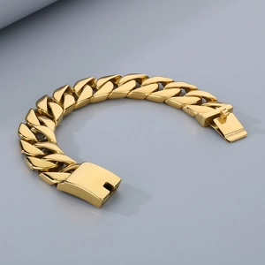 Detailed close-up of 20mm golden Cuban link chain bracelet with a polished box clasp