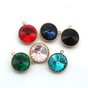 Detail of six colorful round glass crystal pendants with stainless steel frames and rings