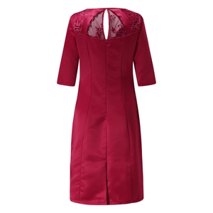 Detail of burgundy satin dress showing lace embroidery and back diamond cutout