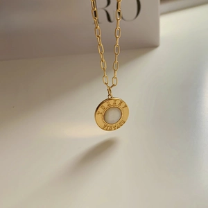 Minimalist gold necklace with vintage round pendant featuring white shell stone inlay