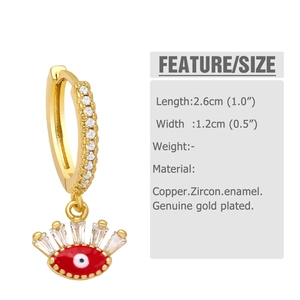 Macro view showing dimensions and materials of gold evil eye earrings with zircon