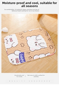 Detail of quilted pet sleeping mat with cat patterns on light wooden flooring