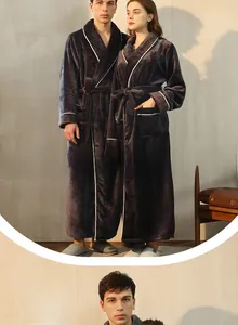 Detail view of charcoal grey flannel couple robes with contrast white piping and belt
