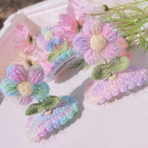 Hand-crocheted puff flower hair clips for girls in vibrant pastel gradient colors