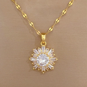 Detailed view of luxury gold-plated snowflake pendant with radiant cubic zirconia stones
