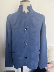Detailed waffle knit texture on blue men's cardigan with large buttons and pockets