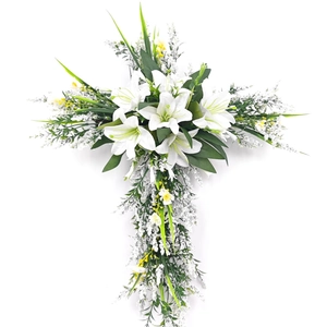 Easter cross wreath with white lilies and yellow flowers for front door decoration