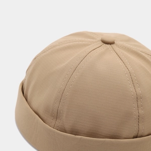 Detail showing khaki breathable fabric texture and stitching of the stylish miki hat